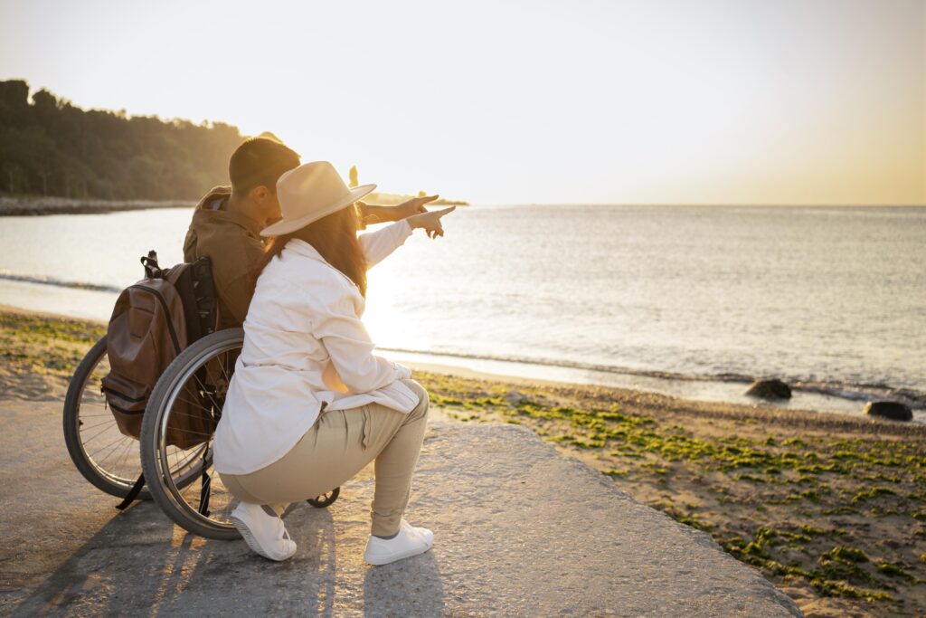 Image by <a href="https://www.freepik.com/free-photo/full-shot-couple-looking-sea_18300462.htm#query=disability%20care&position=14&from_view=keyword&track=ais">Freepik</a>